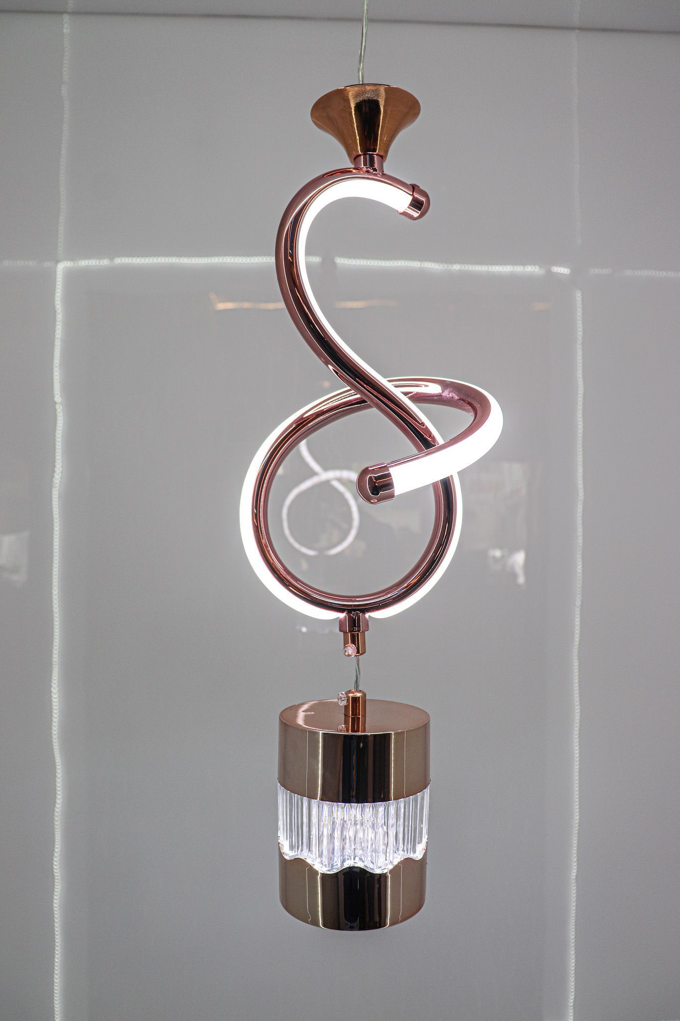 Modern Sophistication with the Rose Gold Swirl Pendant Light